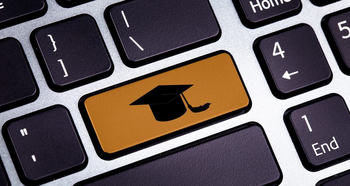 Bottom on a Laptop with Graduate Hat - Close Up