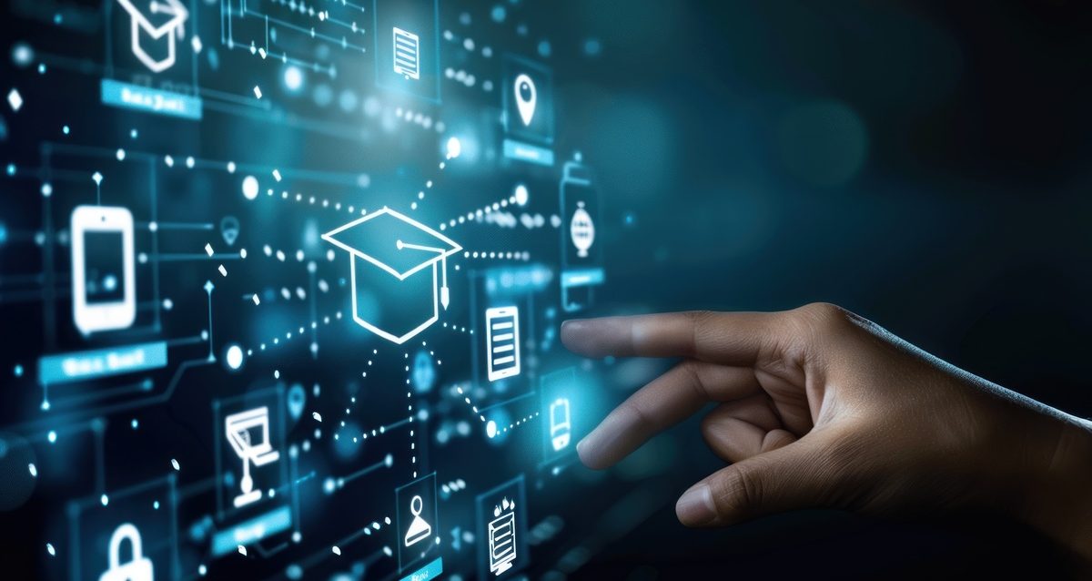 hand touching graduation cap on virtual screen